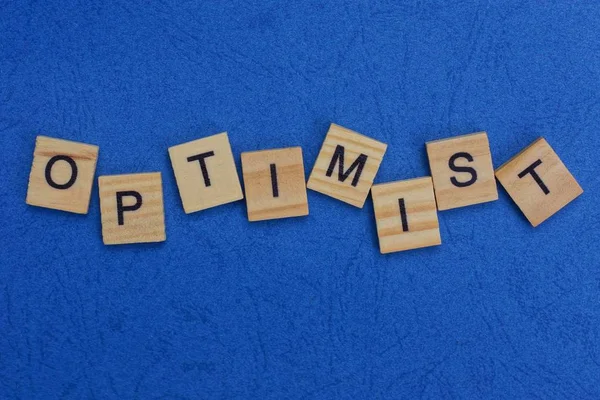 Word Optimist Made Wooden Letters Blue Table — Stock Photo, Image