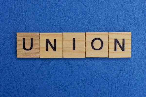 Word Union Made Brown Wooden Letters Blue Table — Stock Photo, Image