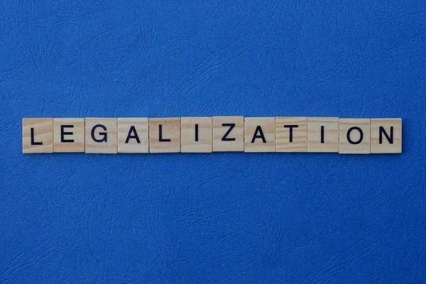 Word Legalization Made Gray Wooden Letters Lies Blue Background — Stock Photo, Image