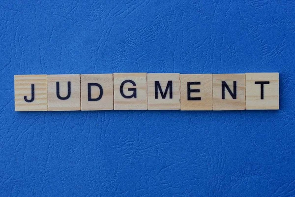 Word Judgment Made Gray Wooden Letters Lies Blue Background — Stock Photo, Image