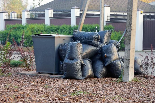 Pile Black Full Plastic Bags Gray Metal Dumpster Street — Stock Photo, Image