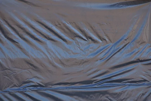 Textura Plástico Negro Trozo Celofán Arrugado Pared — Foto de Stock