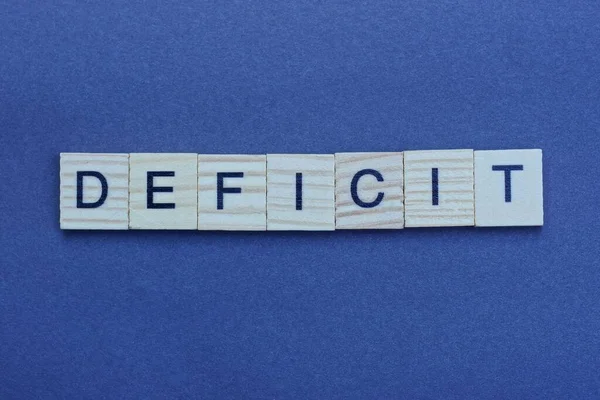 Testo Del Deficit Parola Grigio Piccole Lettere Legno Uno Sfondo — Foto Stock