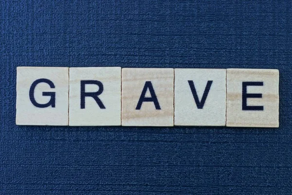 Text Word Grave Gray Wooden Letters Black Table — Stock Photo, Image