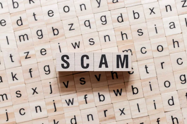 Scam word concept on cubes — Stock Photo, Image