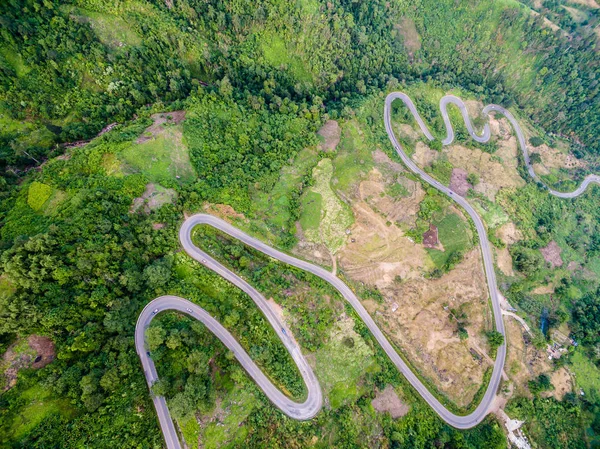 Aerial view of crooked path of road on the mountain, Shot from d — Stock Photo, Image