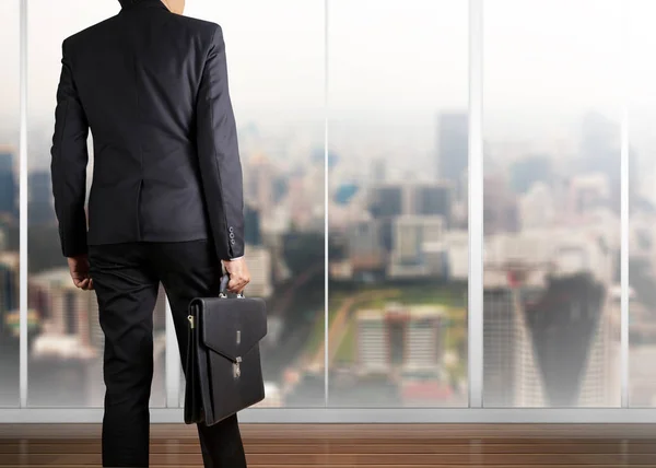 Businessman holding a briefcase — Stock Photo, Image