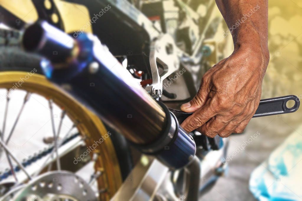 Hand with wrench, Professional mechanic repair and modifications
