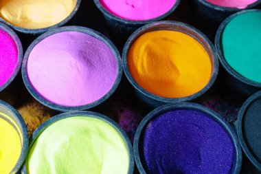 Colorful sands in boxes