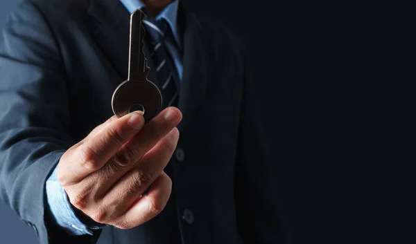 Close up of businessman holding the key to success concept — Stock Photo, Image