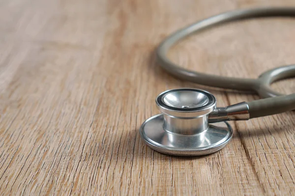 Stethoscope on a wooden background — Stock Photo, Image