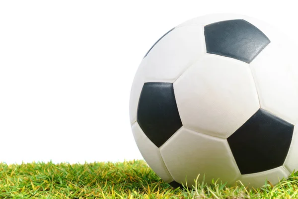 Soccer ball on green grass isolated on white background — Stock Photo, Image