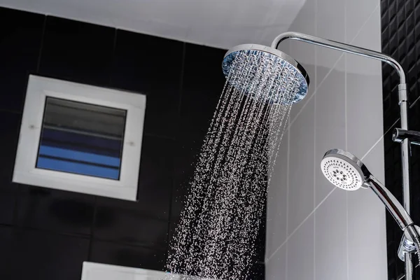 Close up of Water flowing from shower in the bathroom — Stock Photo, Image