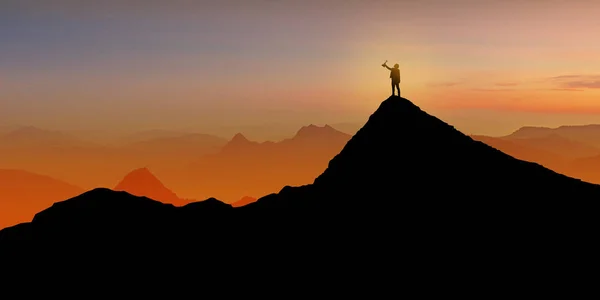 Silueta podnikatele stojící na vrcholu hory nad východem slunce — Stock fotografie