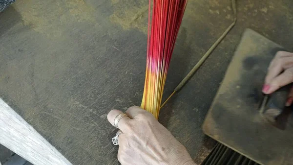 factory producing colorful incense sticks in vietnam