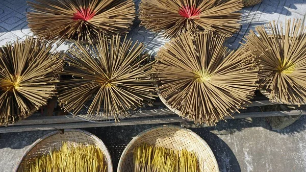 factory producing colorful incense sticks in vietnam