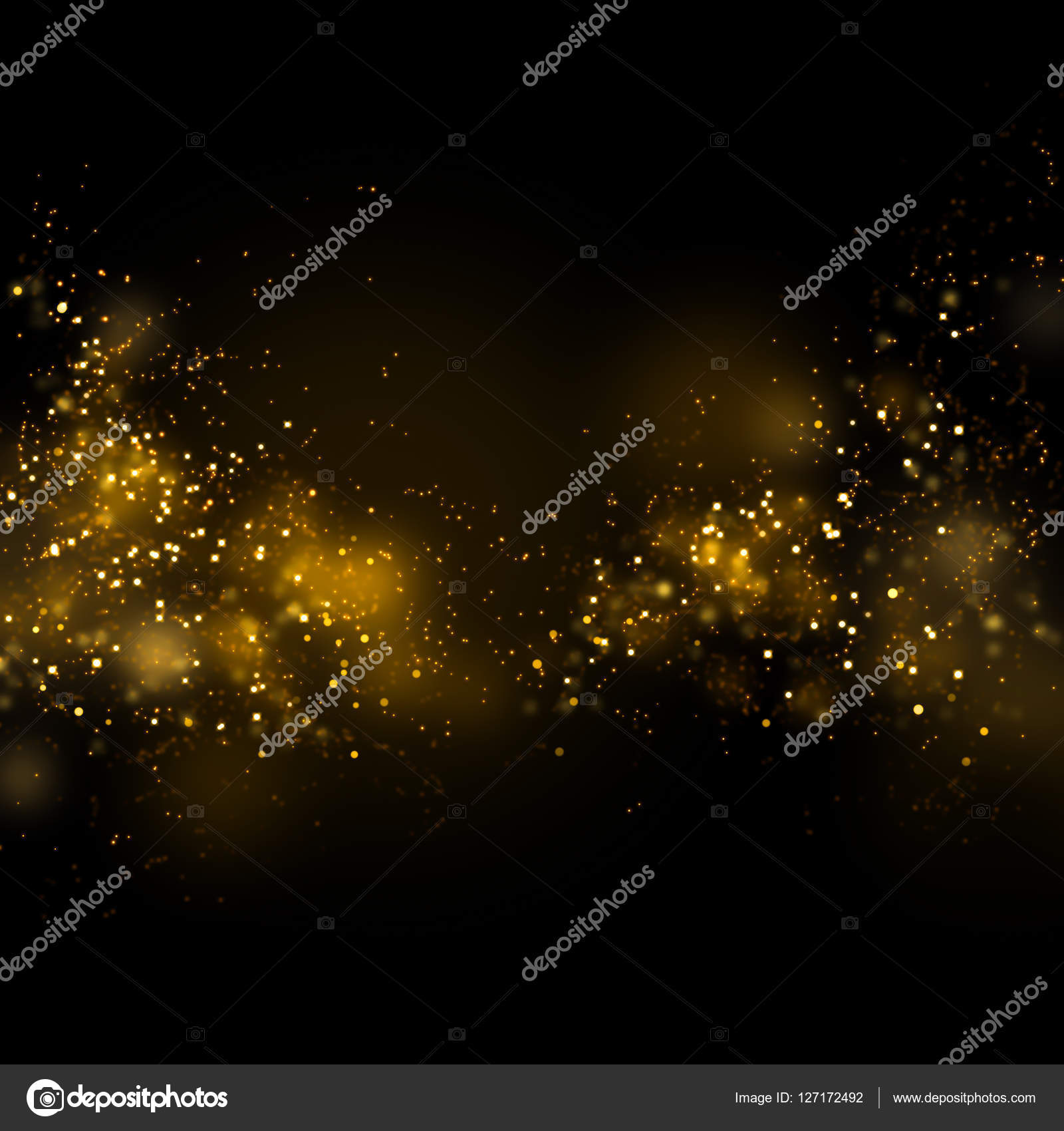 Gold glittering star magic dust on background. Stock Photo by