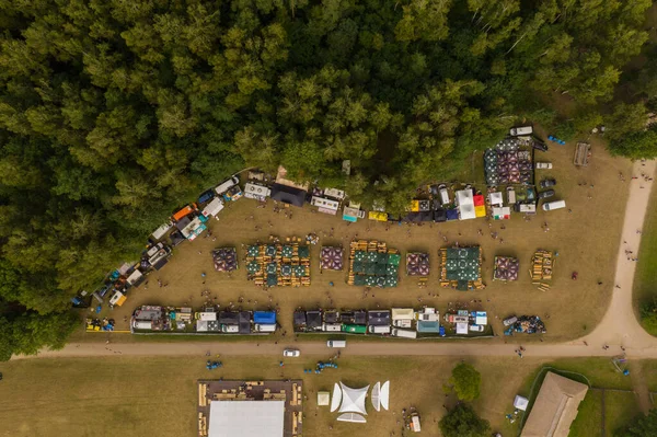 Drone photography of food stalls during music festival.