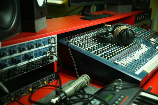 headphones on a mixer in a music recording studio close up