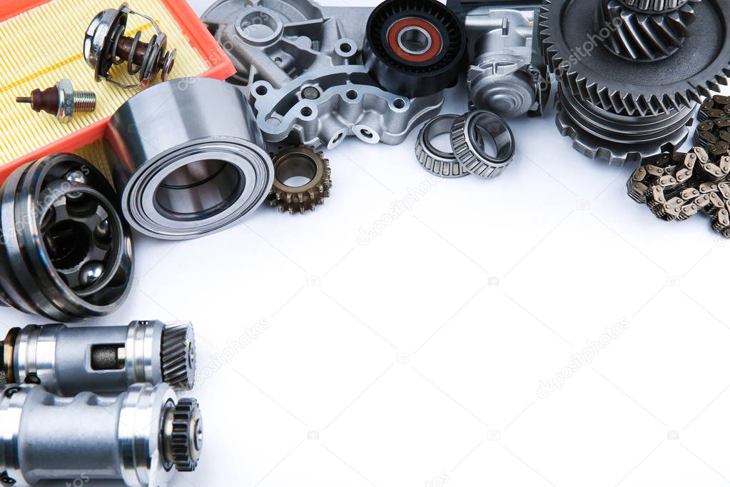 different car spare parts on white background with copy space