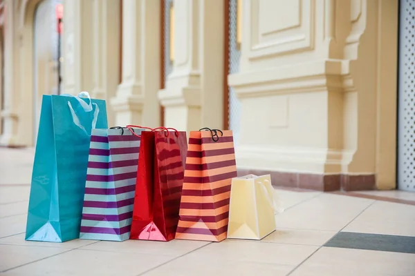 colorful shopping bags in the luxury mall close up