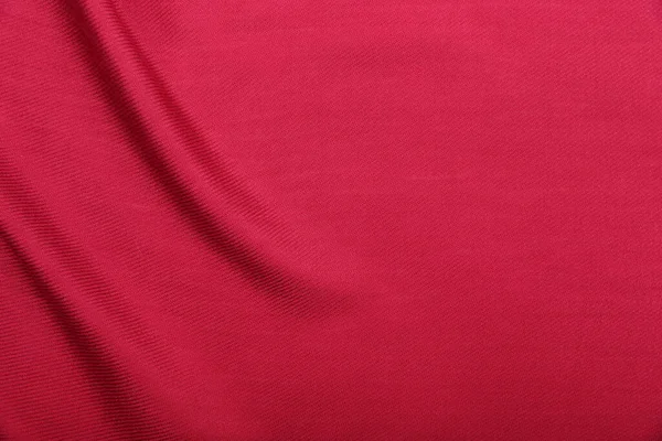 background of red fabric with creases