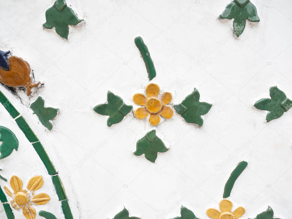 Sculpture from tiles is colorful,Pattern as Flower design Thai style,Temple name is Wat Arun Ratchawararam Woramahaviharn at Bangkok Thailand