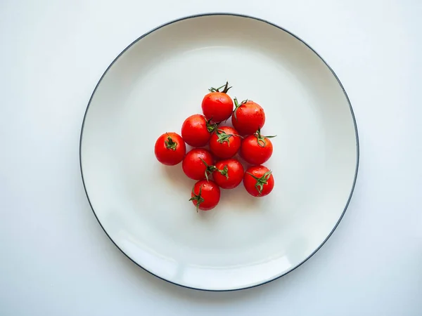Red tomatoes Put on dish White,Food for healthy,white background