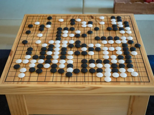 Go game Promote brain development, black and white, wooden board with four square