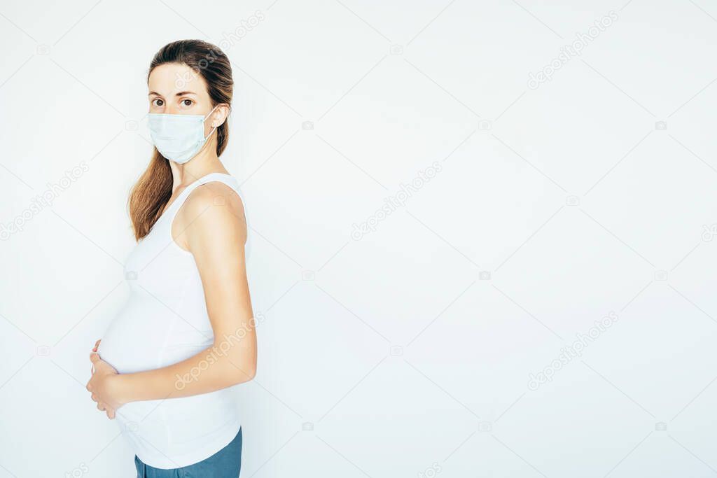 Pregnant woman in mask.