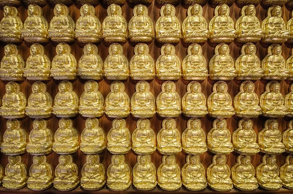 Pattern of golden Chinese Buddha in Thailand