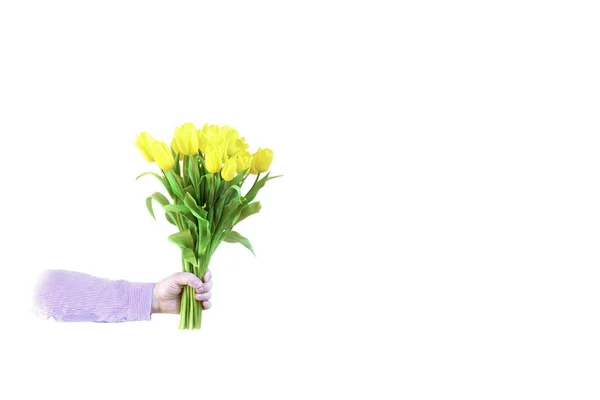 Hand met een boeket bloemen. — Stockfoto