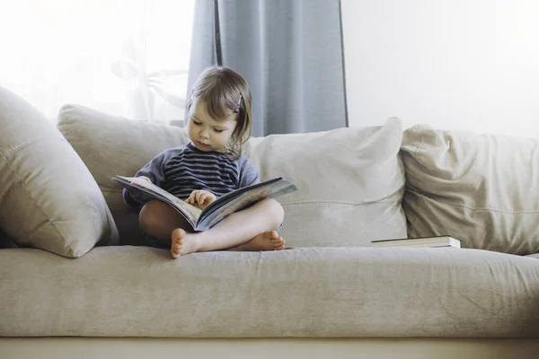 Girl reading at home.