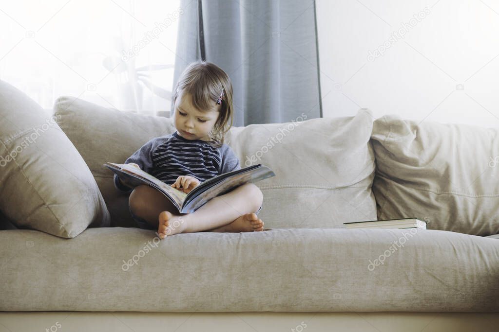 Girl reading at home.