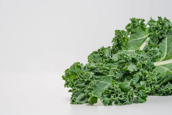 Fresh kale leaves on white background — Stock Photo, Image