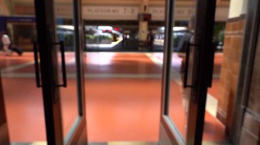 Blur Slow motion video of People passing through Wellington Railway Station, New Zealand