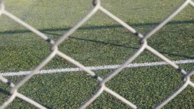 Artificial grass football field; Slow motion