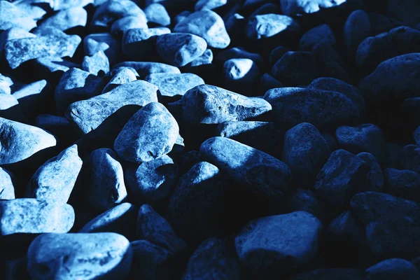 Background of dark blue stones.