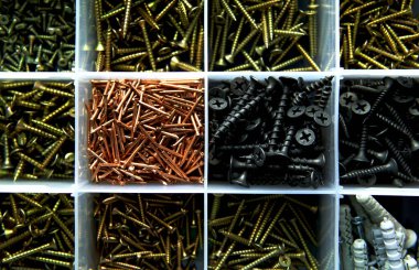 Different screws and nails in the box.