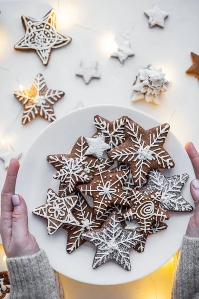 Gingerbread cookie in the form of stars and snowflakes on a white background. painted with white glaze — Stock Photo, Image