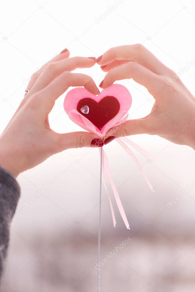 Valentine's Day. Declaration of love. heart in the hands of a girl.