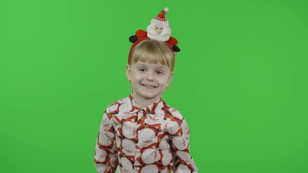 Happy beautiful little girl in a shirt with a Santa Claus. Christmas. Chroma Key — Stock Video