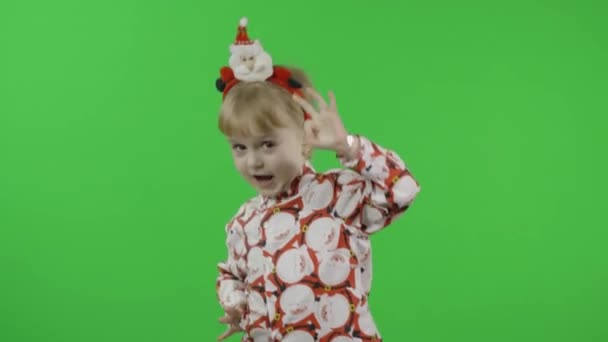 Happy beautiful little girl in a shirt with a Santa Claus. Christmas. Chroma Key — Stock Video