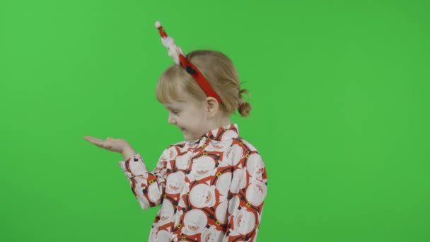 Happy beautiful little girl in a shirt with a Santa Claus. Christmas. Chroma Key — Stock Video