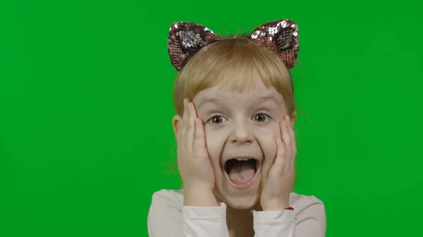 Girl in headband with a cat ears shows amazement. Happy four years old child — 스톡 사진