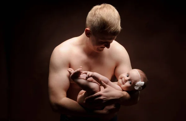 Male holding nice infant baby girl. New life concept. Daughter on fathers arms — Stock Photo, Image