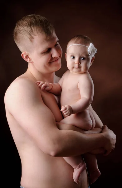 Male holding nice infant baby girl. New life concept. Daughter on fathers arms — 스톡 사진