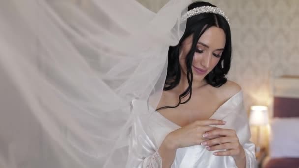 Beautiful and lovely bride in night gown and veil. Wedding morning. Slow motion — Stock Video