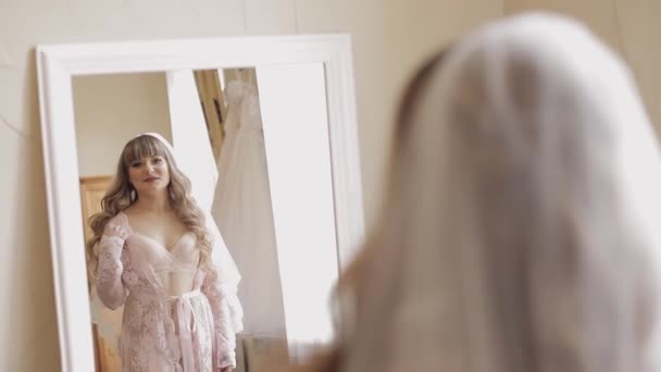Beautiful and lovely bride in night gown and veil. Wedding morning. Slow motion — Stock Video