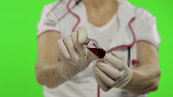 Hands of elderly female doctor. Test tube with analyzes. Coronavirus. Covid-19 — Stock video